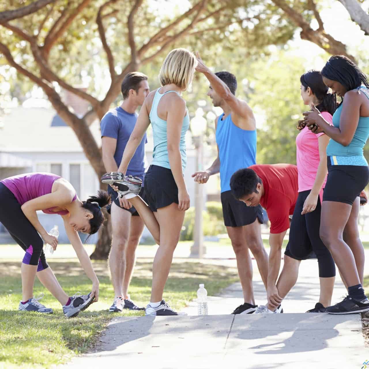 Group Of Runners Warming Up Before Run